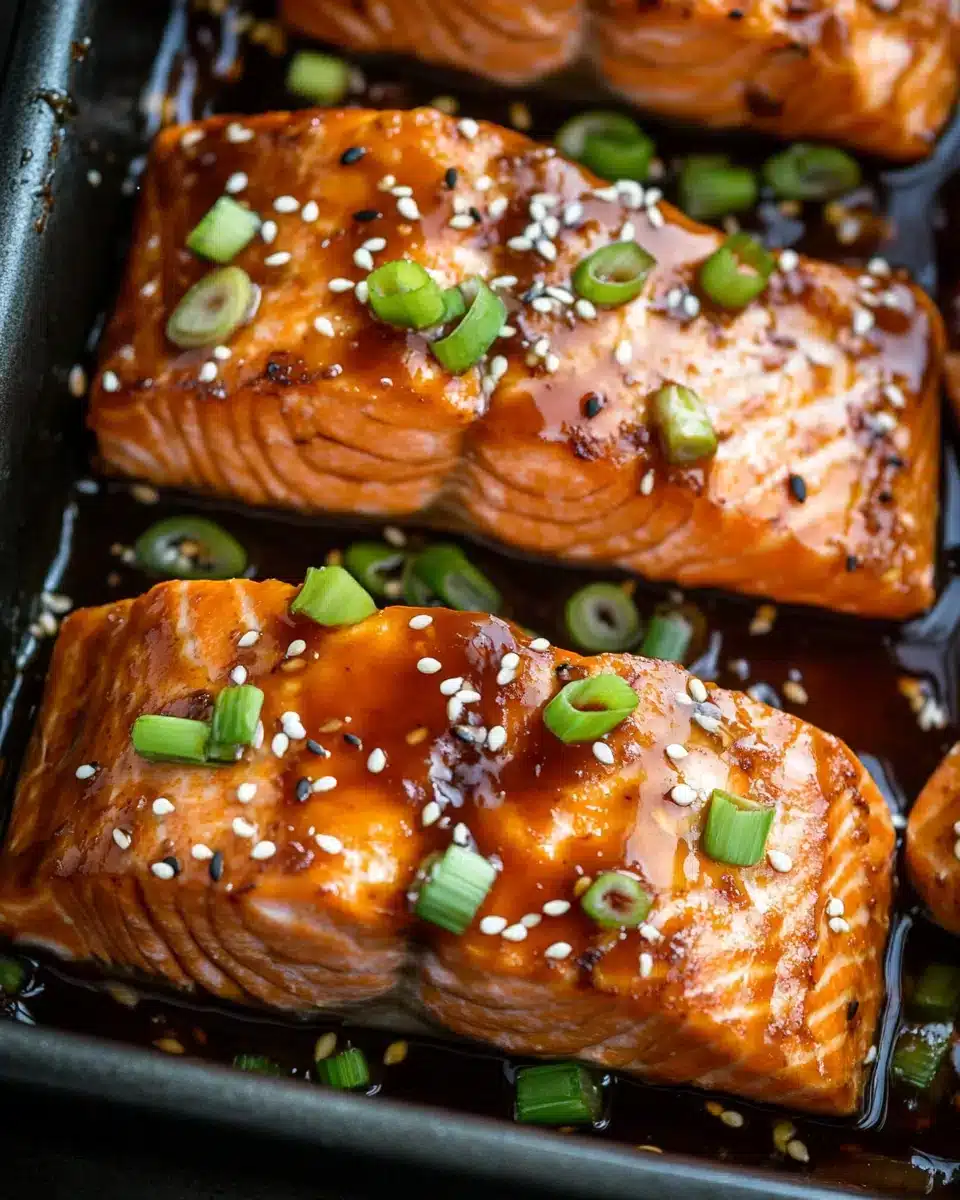 Baked Teriyaki Salmon Recipe with glossy glaze and scallions.