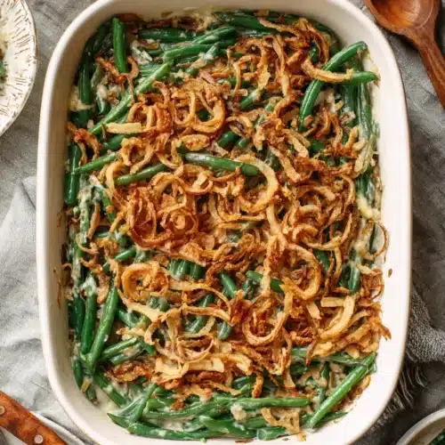 Best Green Bean Casserole in a white baking dish with crunchy topping.