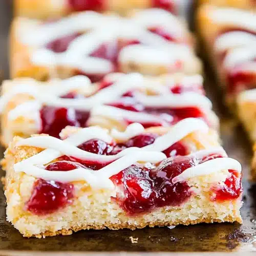 Delicious Christmas Cherry Bars topped with icing.
