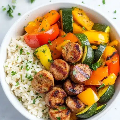 Delicious easy air fryer chicken sausage and veggies served in a bowl.