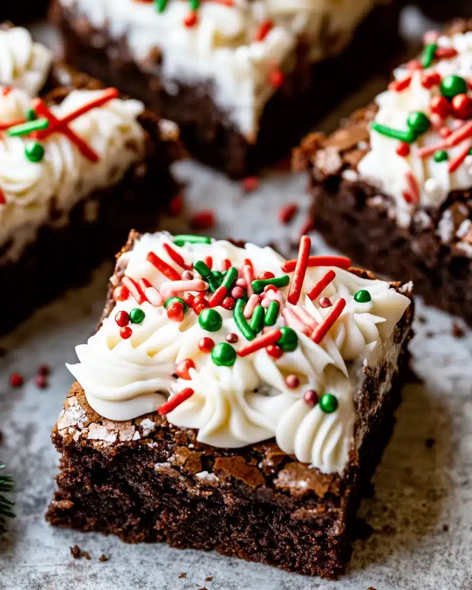 Easy Christmas Brownies with Festive Icing Delicious Easy Christmas Brownies topped with festive icing and sprinkles.