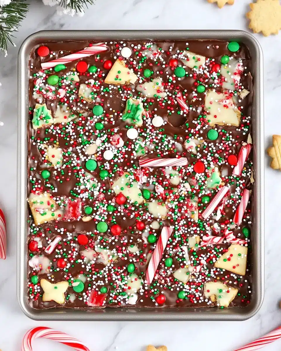 Easy Christmas Chocolate Bark Treat Easy Christmas Chocolate Bark decorated with candy canes and sprinkles.