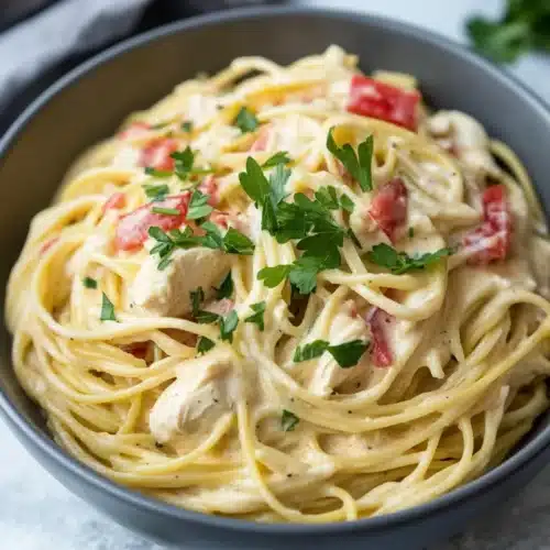 Easy Crockpot Chicken Spaghetti 1 Creamy Easy Crockpot Chicken Spaghetti with parsley garnish