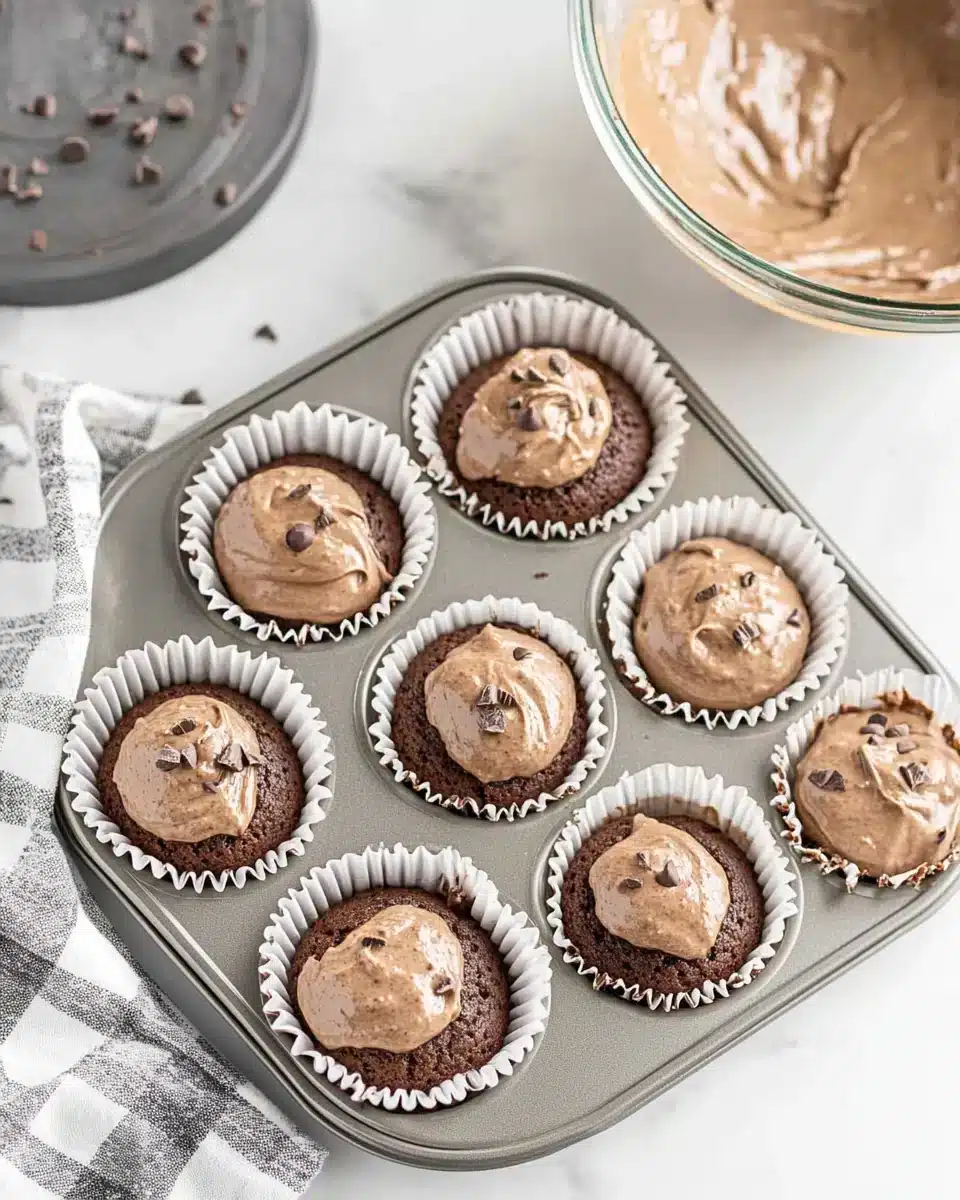 Easy Halloween Ghost Cupcakes Preparation Easy Halloween Ghost Cupcakes ready to bake in a muffin tin.