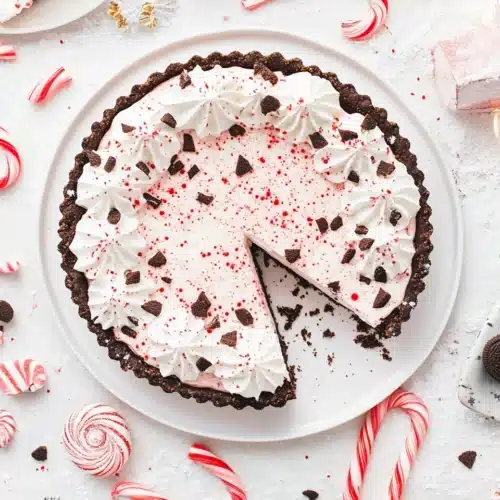 Peppermint Pie with creamy filling and Oreo crust, festive holiday dessert.