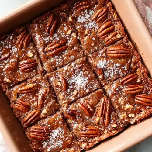 Delicious Salted Maple Pecan Pie Bars with salted pecans and caramel drizzle.