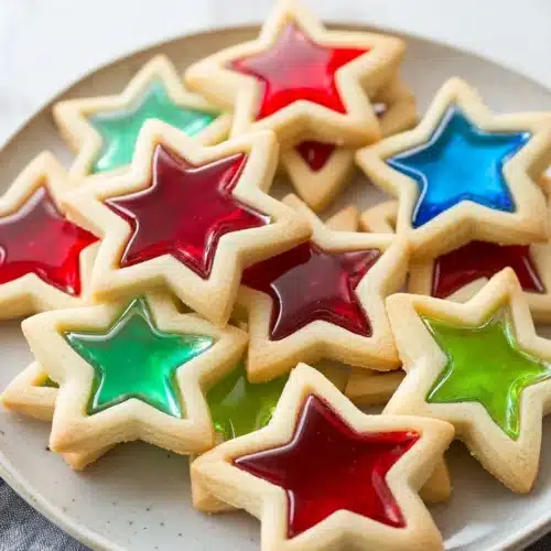 Stained Glass Cookies 1 Beautiful stained glass cookies showcasing vibrant colors and star shapes.