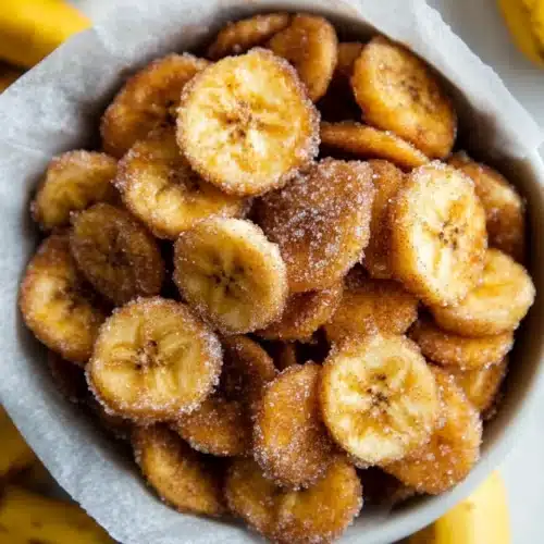 Sweet Cinnamon Air Fryer Banana Chips 1 Sweet Cinnamon Air Fryer Banana Chips in a bowl with crispy texture.
