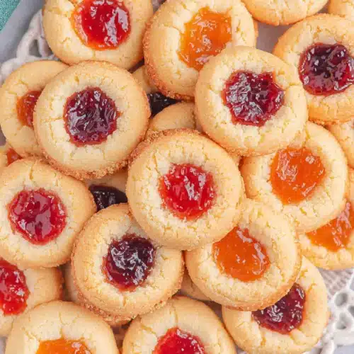 Delicious thumbprint cookies with colorful jam centers for festive gatherings.