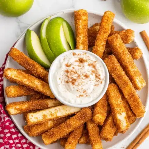 Air Fryer Apple Fries 1 Delicious Air Fryer Apple Fries served with creamy dip.
