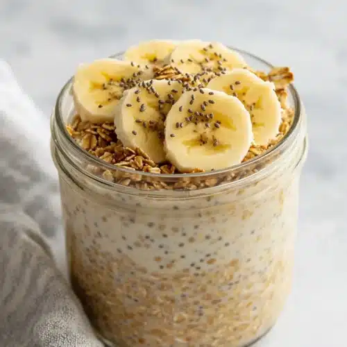 Brown Sugar Overnight Oats with bananas and granola in jars