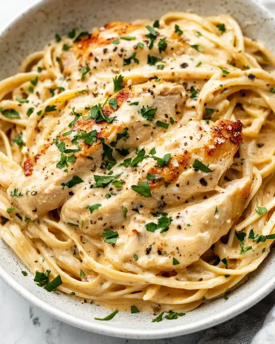 Crockpot Angel Chicken Delight Delicious Crockpot Angel Chicken with creamy sauce over pasta.