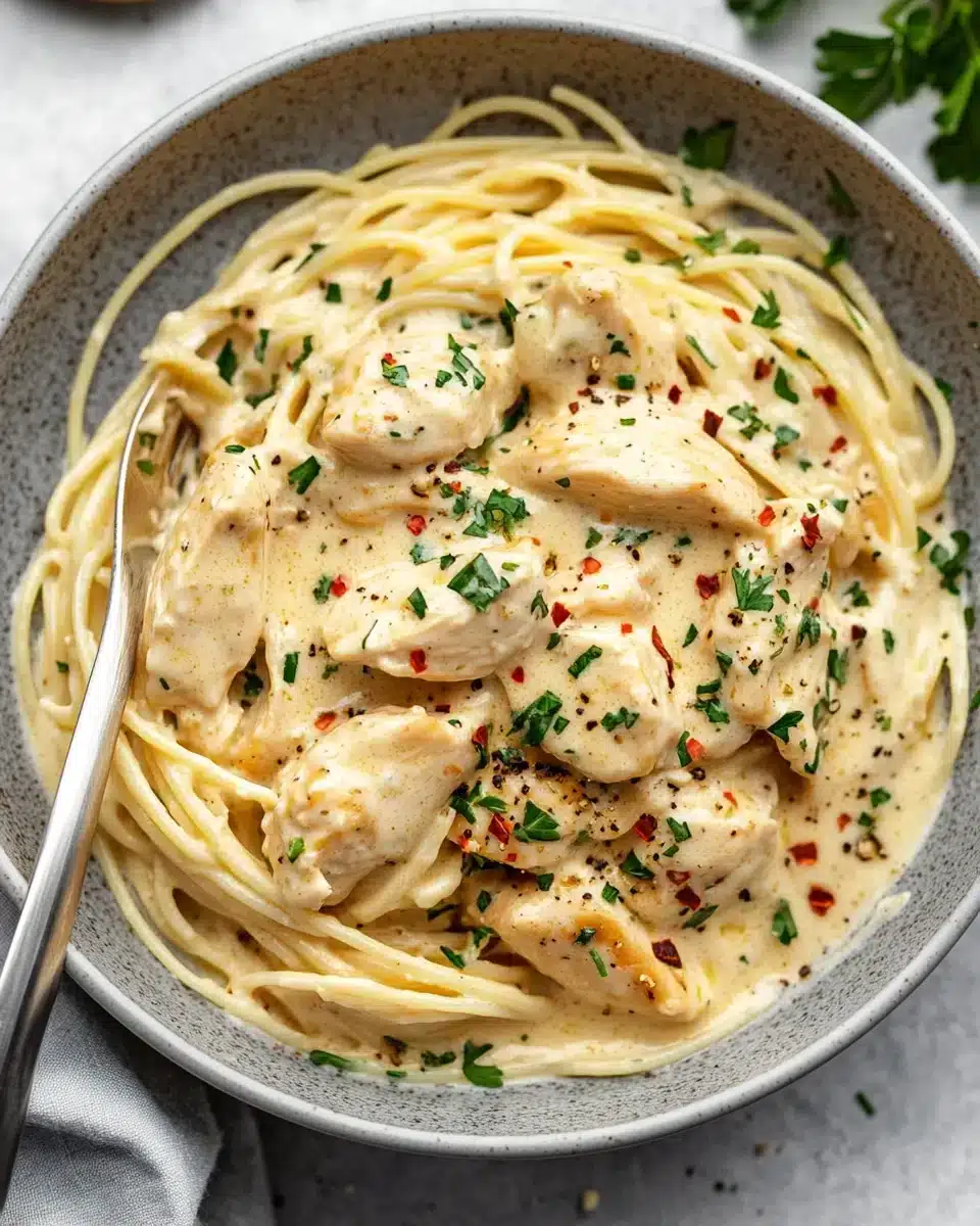 Crockpot Angel Chicken Dish Crockpot Angel Chicken with creamy sauce over angel hair pasta.