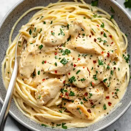 Crockpot Angel Chicken 1 Crockpot Angel Chicken with creamy sauce over angel hair pasta.