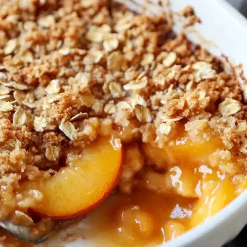 Delicious Peach Crisp, a comforting dessert filled with juicy peaches.