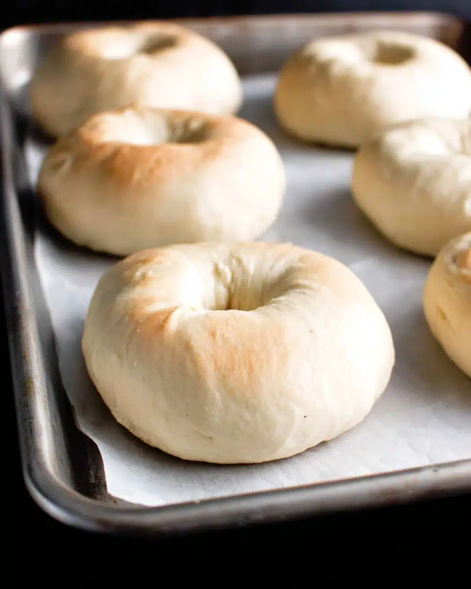 Homemade bagels ready for boiling, recipe included.