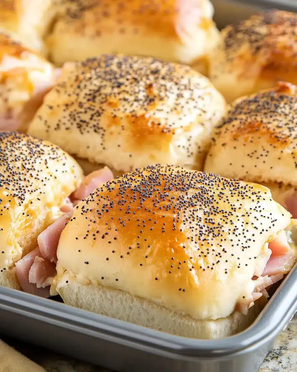 Baked Ham and Cheese Sliders with poppy seed topping
