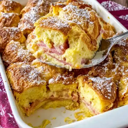 Delicious breakfast casserole made with croissants and ham.