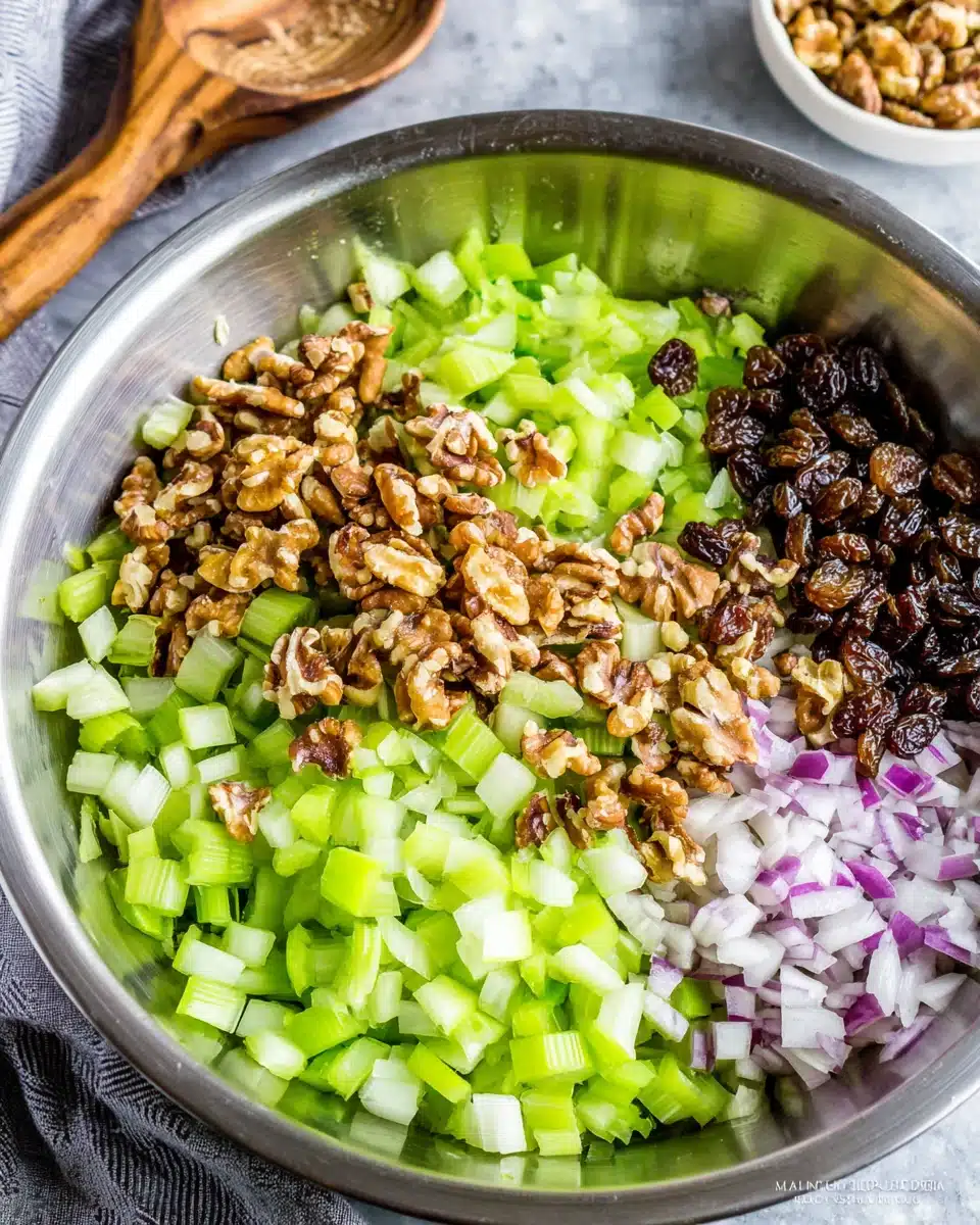 Celery salad with raisins and walnuts for a crunchy side dish.
