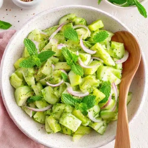 Crispy cucumber celery salad with fresh herbs and ingredients.