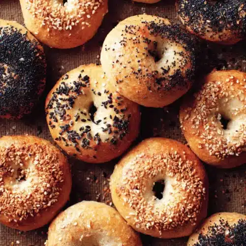 Delicious homemade bagels topped with seeds.