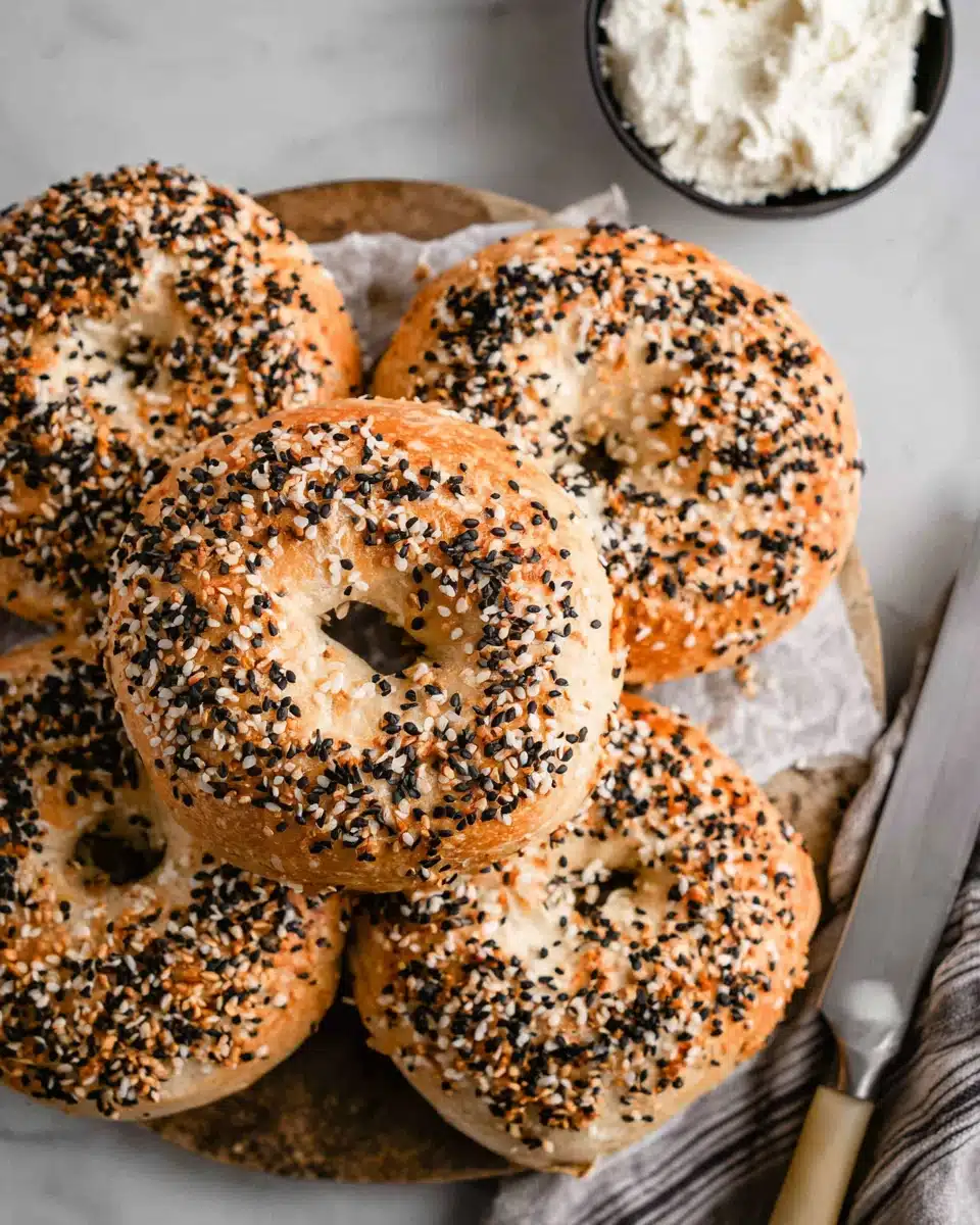 High protein bagels topped with sesame seeds and seasoning.