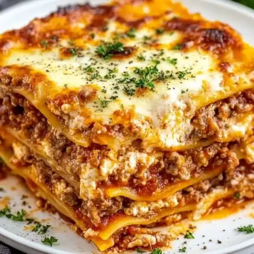 Delicious Homemade Lasagna Recipe with Ricotta Cheese displayed on a plate.
