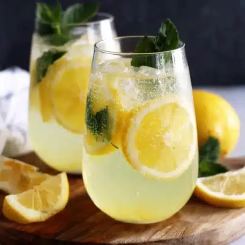 Limoncello Spritz: A Refreshing Summer Delight 1 Limoncello spritz in elegant glasses with lemon and mint.