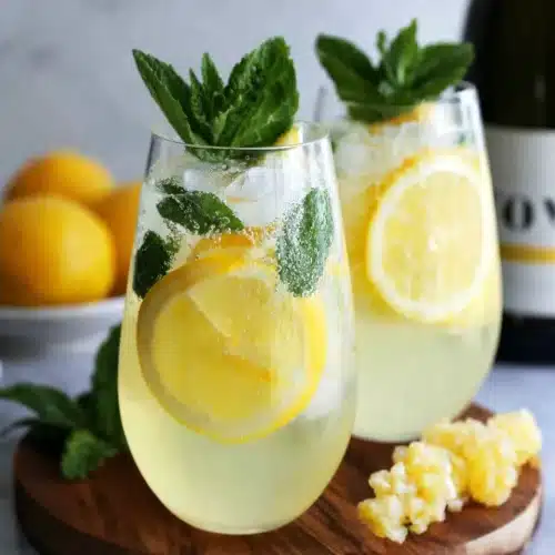 Refreshing limoncello spritz cocktail with lemon and mint.
