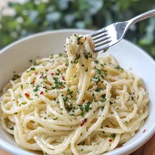 Delicious One Pot Creamy Garlic Pasta ready to serve in a bowl.