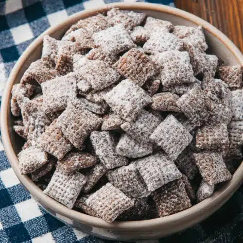 Delicious puppy chow treat featuring chocolate and peanut butter flavors.