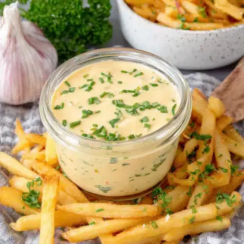Delicious roasted garlic aioli served with crispy fries.