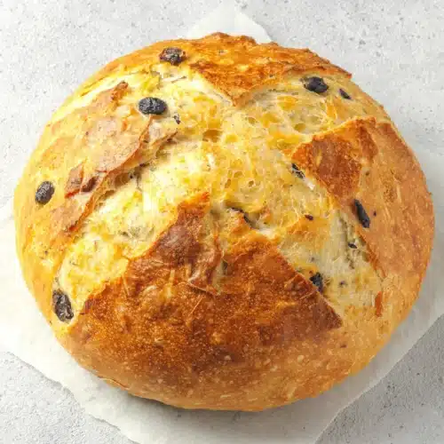 Delicious sourdough bread with dried blueberries and crispy crust.