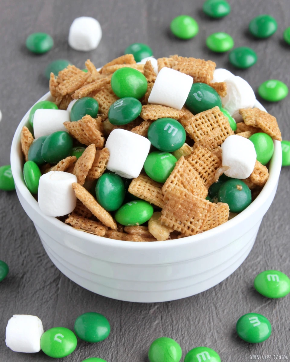 Festive St. Patrick's Day Trail Mix Recipe St. Patrick's Day trail mix with green M&M's, marshmallows, and cereal.