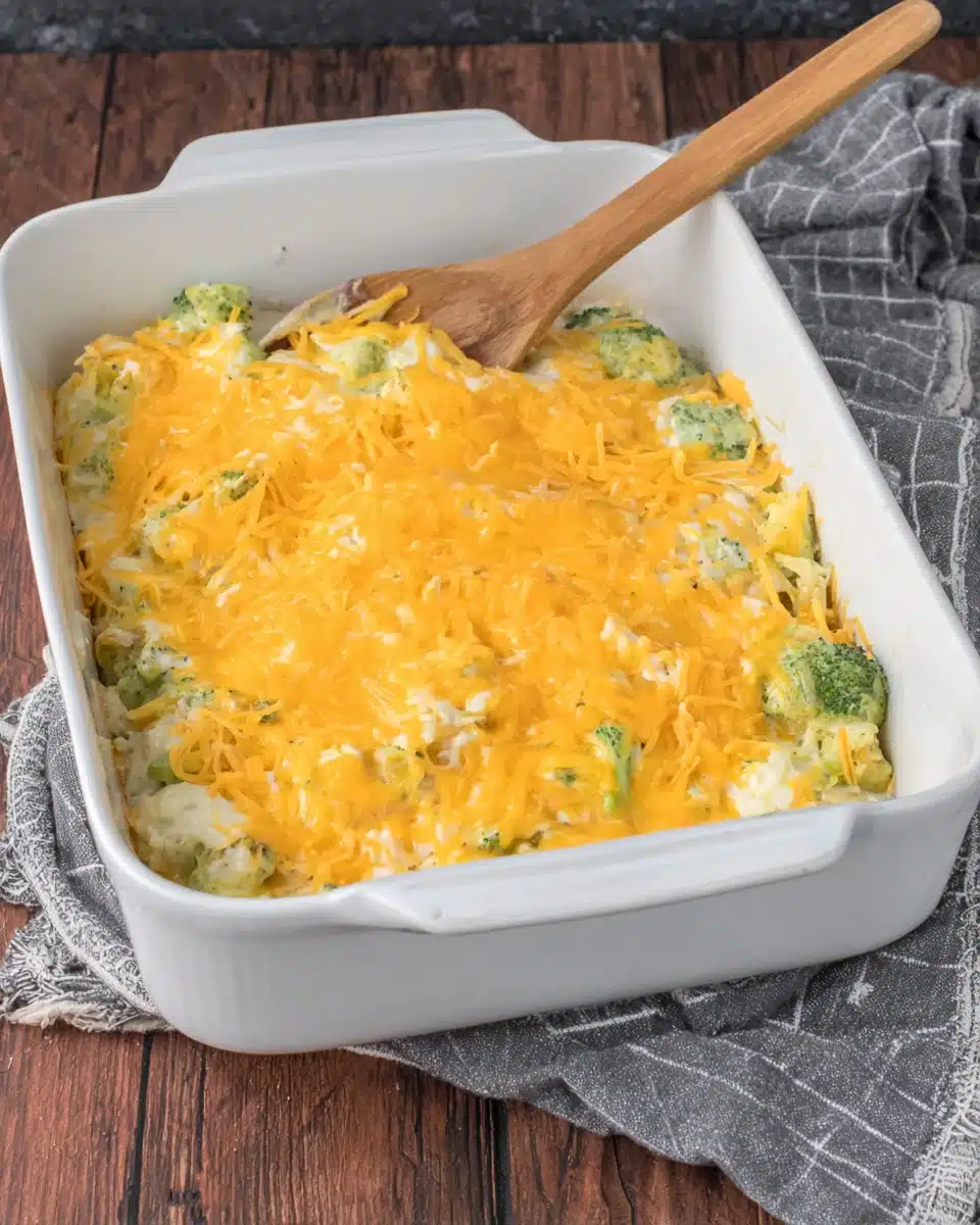 Broccoli casserole topped with cheddar cheese.