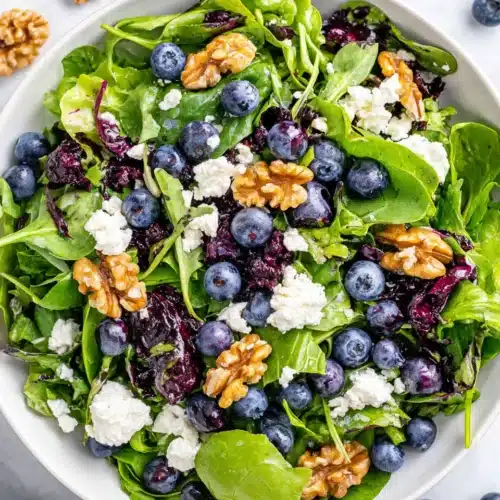 Delicious Easter salad with blueberries, goat cheese, and walnuts.