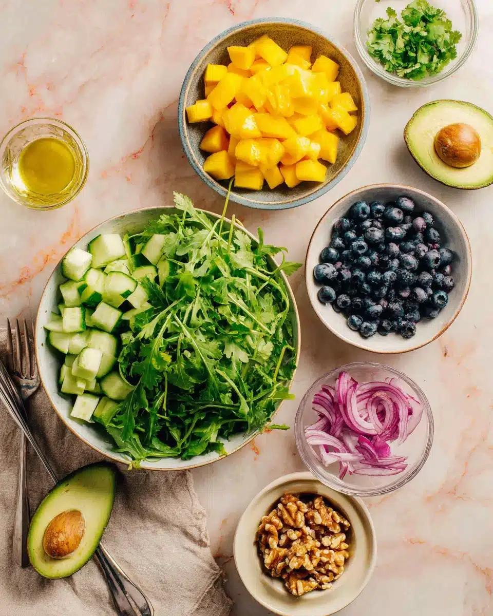 Vibrant mango cucumber salad ingredients for a refreshing dish.