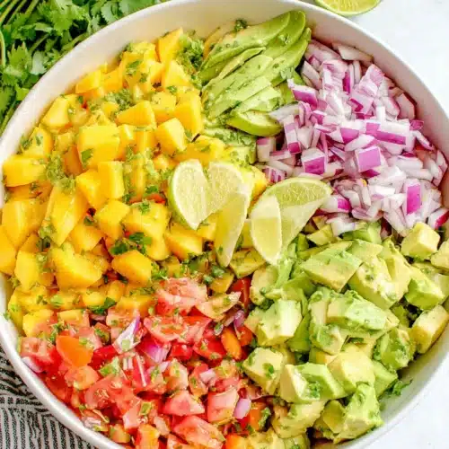 Vibrant mango salad with fresh ingredients for a healthy meal.