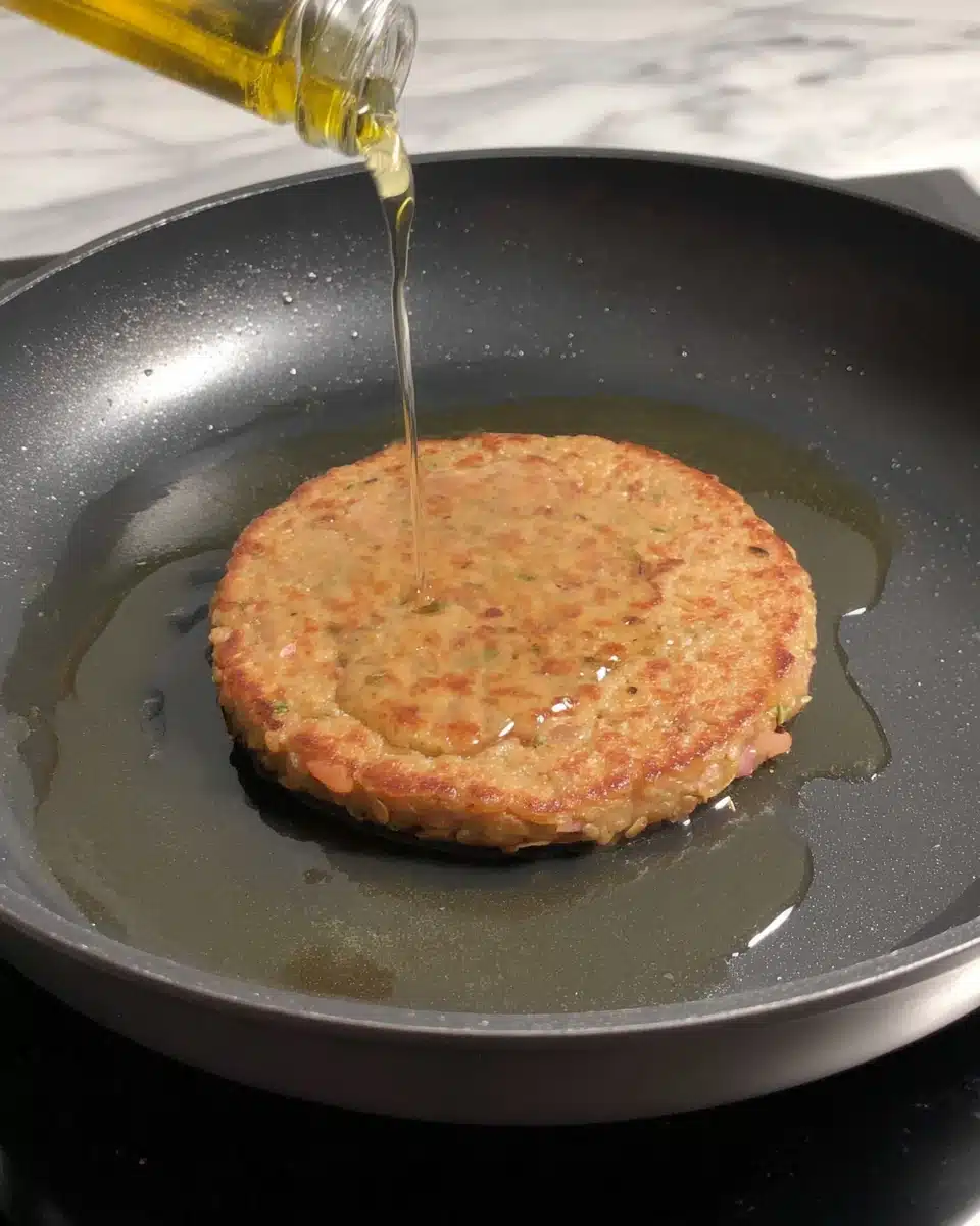 Cooking masoor dal chilla pancakes.