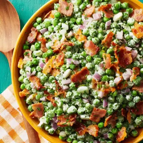 Creamy pea salad with bacon and cheddar cheese.