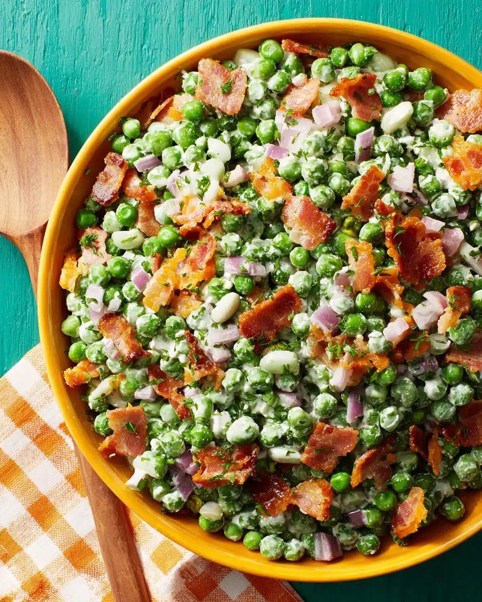 Creamy pea salad with bacon and cheddar cheese.