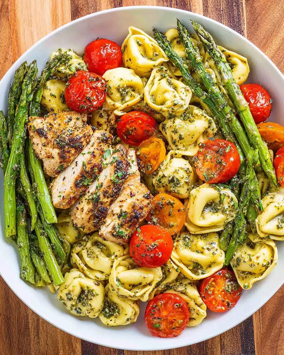 Delicious Pesto Chicken Tortellini Recipe Pesto chicken tortellini with asparagus and tomatoes
