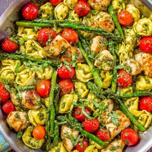 Pesto Chicken Tortellini: A Deliciously Simple Recipe 1 Pesto chicken tortellini with asparagus and cherry tomatoes.
