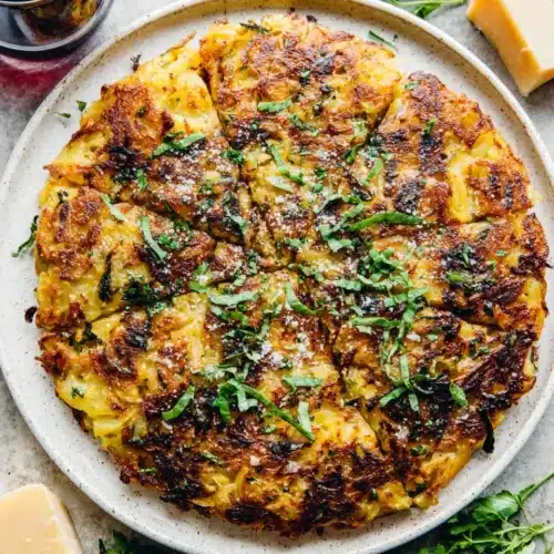 Crispy potato hash with cheese and herbs