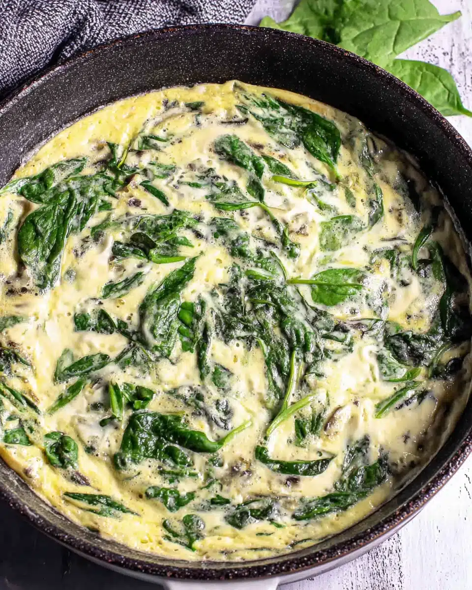 Delicious spinach frittata preparation with eggs and spinach.