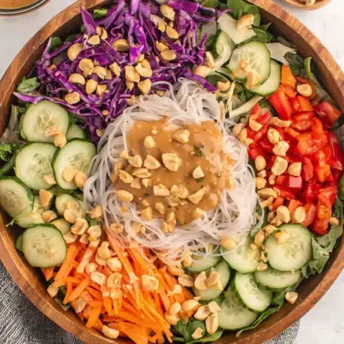 Delicious spring roll salad with vibrant vegetables and peanut dressing.