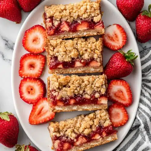 Strawberry oatmeal crumble bars dessert on a plate.