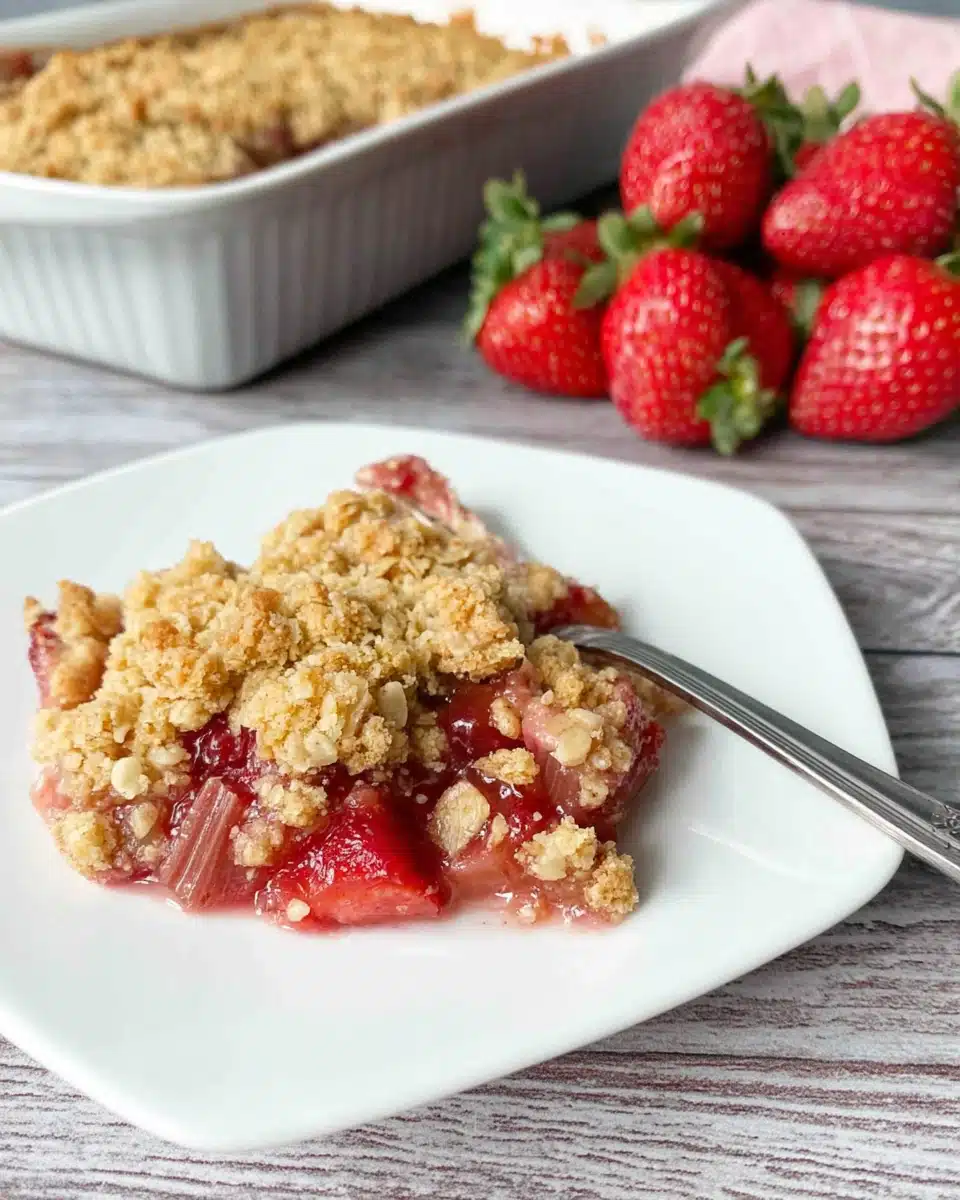 Strawberry Rhubarb Crisp Delight Delicious strawberry rhubarb crisp slice on a plate.