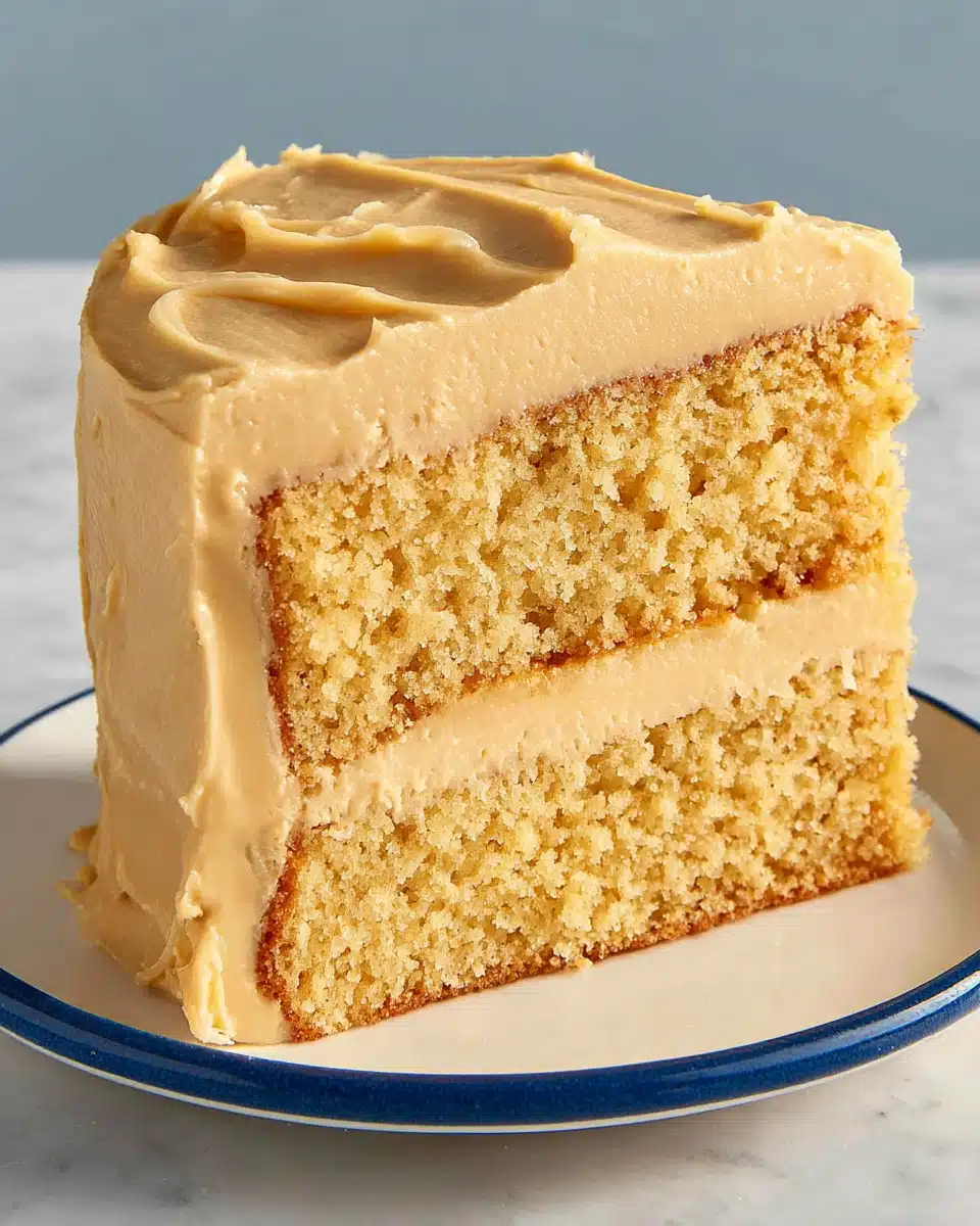 Brown sugar salted caramel cake slice with frosting.