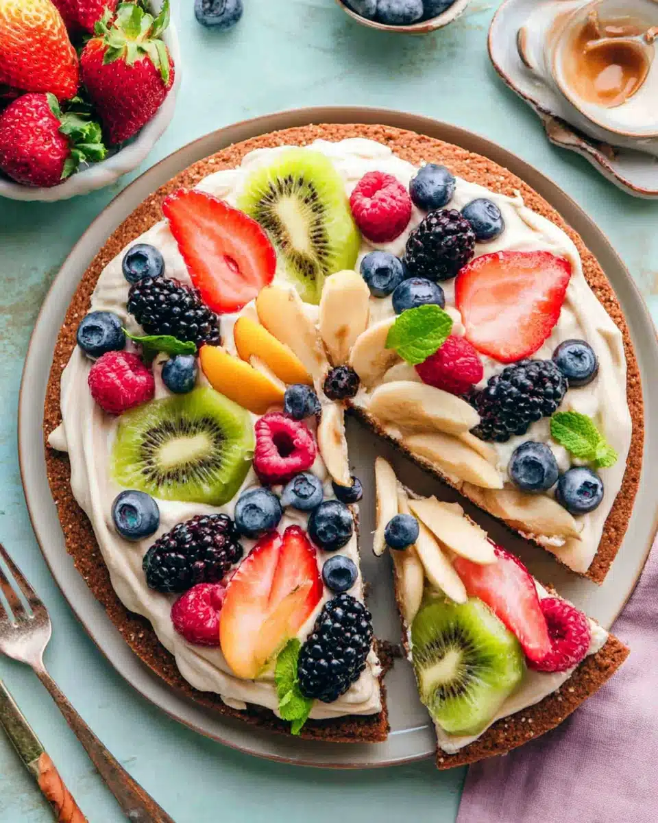 Dessert pizza with brown sugar cookie & colorful fruits.
